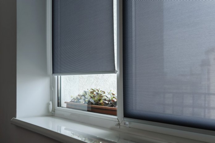 Gray roller shutters on the window.
